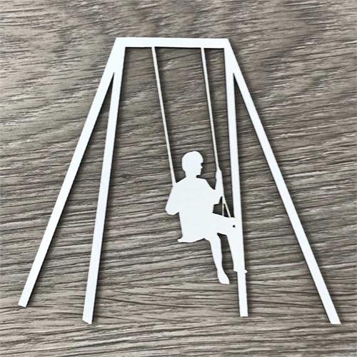 Boy on a swing set